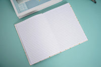 Open lined notebook with two-page spread