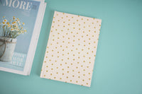 Gold polka dot notebook cover, flat view