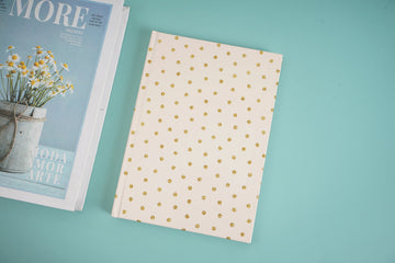 Gold polka dot notebook cover, flat view
