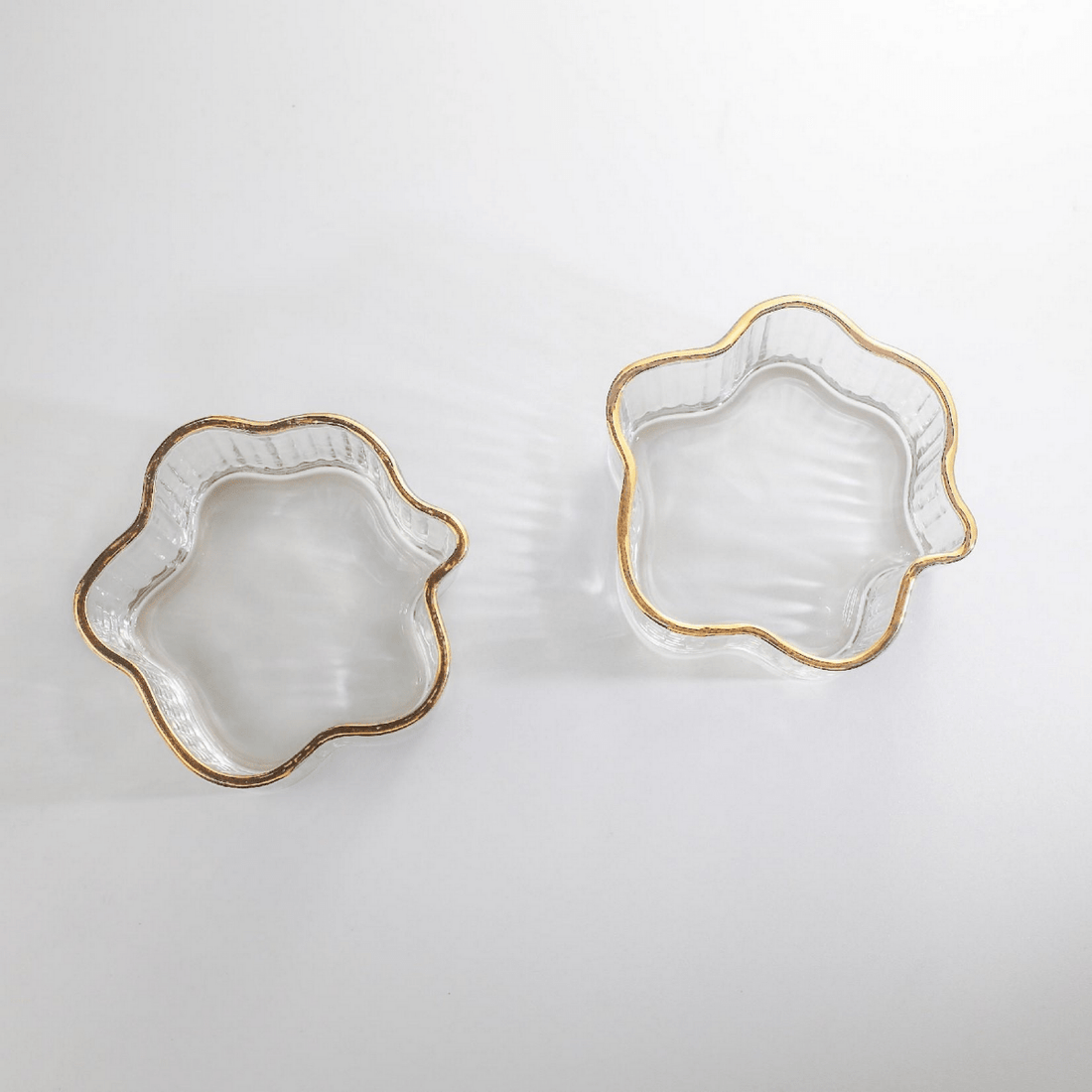 Glass flower bowls with gold-toned rim, set of 2, scalloped petal shape.