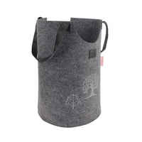 Grey felt laundry basket with side strap handles and tree graphic