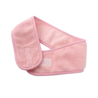 Light pink coral fleece hair headband, angled view with stitched front