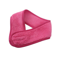 Rose pink coral fleece hair headband, angled view with looped front knot
