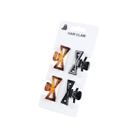Set of four bow-style hair claws, two brown and two black on a card