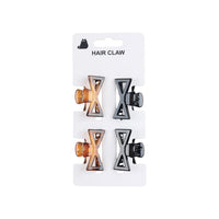 Set of four bow-style hair claws, brown and black clips on display card