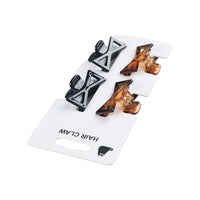 Back of set of four bow-style hair claws with black and brown clips