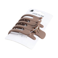 Taupe hair claw clip with curved teeth and open back on package card