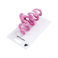Pink spiral hair claw clip, translucent, shown from side on card backing.