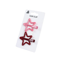 Two star hair clips, pink and dark red, on a blister card