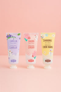 Three hand cream tubes with Camellia, Sakura Ceriser, and Chamomile labels