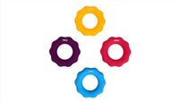Four hand gripper rings separated: yellow, purple, red, and blue