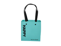 Turquoise gift bag with black handles, front panels with 'Happy' branding