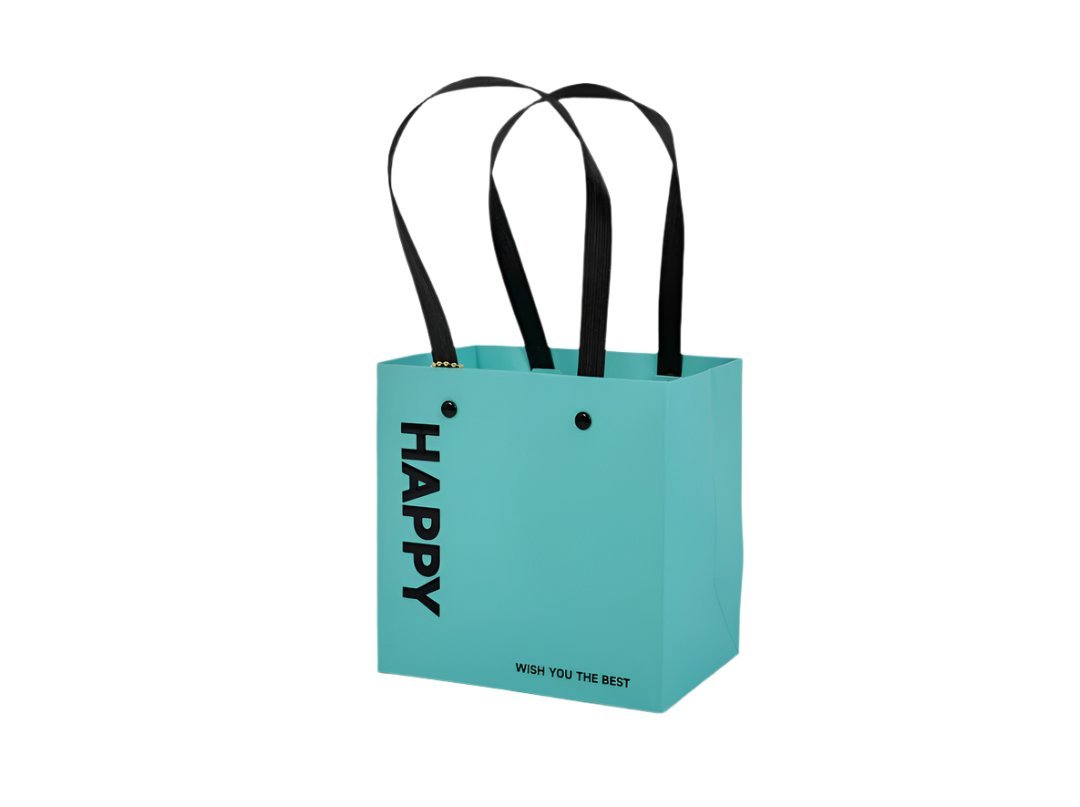 Turquoise gift bag with black handles and 'Happy' text on front