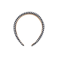 Black and white checkered headband with tan inner band, rounded shape
