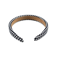 Black and white checkered headband with tan inner band, open arc