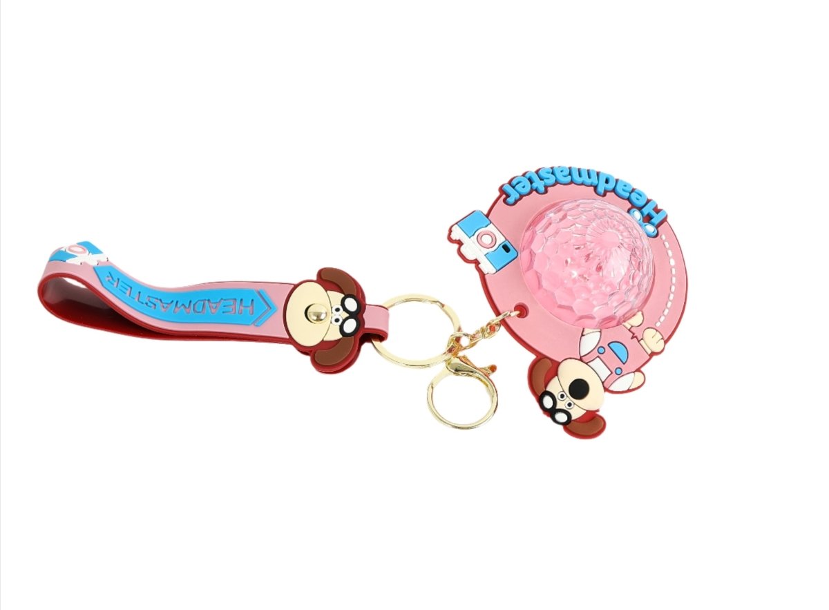 Red and blue dog cartoon keychain with pink glitter disc and Headmaster text