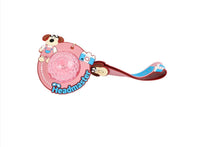 Dog cartoon keychain with pink glitter disc, red strap, and blue trim