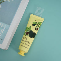Avocado hand cream tube with avocado label, yellow-green squeeze tube