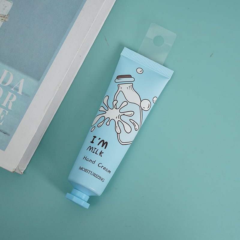 I'm Milk hand cream tube, light blue, label facing forward on flat surface