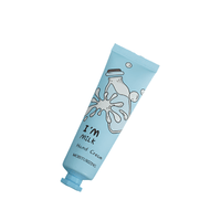 I'm Milk hand cream tube, light blue, front label and squeeze cap visible