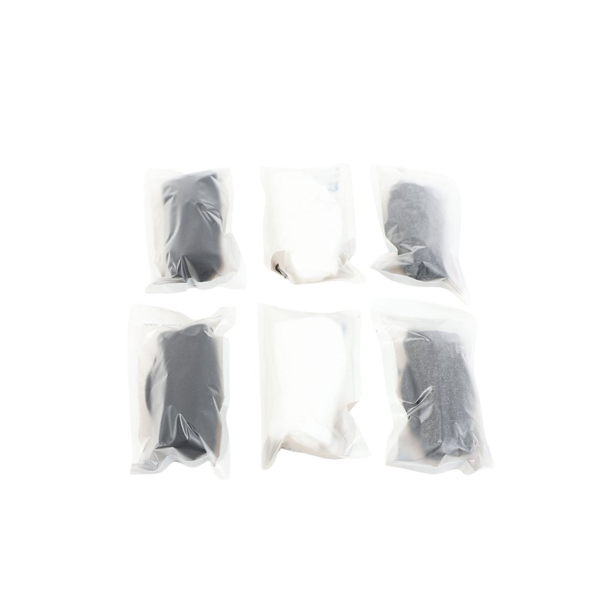 Assorted disposable socks in white and gray, each sealed in plastic bags