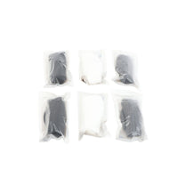 Assorted disposable socks in white and gray, each sealed in plastic bags