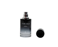 Mens JAKSAA perfume bottle with silver cap; detached dark top shown