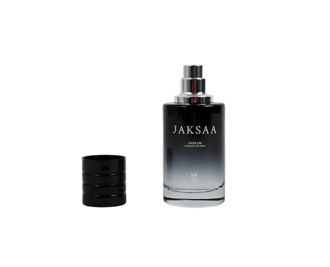 Mens JAKSAA perfume bottle with silver cap and detached dark cap piece