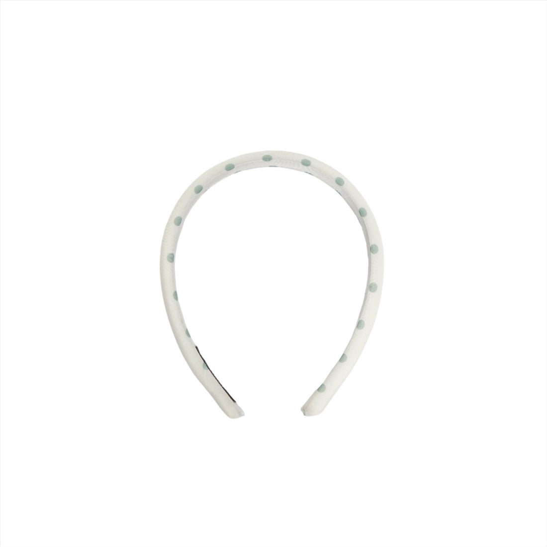 White polka-dot headband with green dots, open curved profile