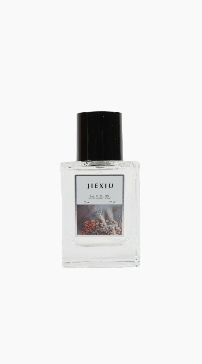 JEXIU eau de toilette bottle with black cap, clear glass and printed label