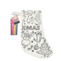 Coloring Christmas stocking in cream fabric with black holiday icons