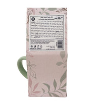 Gift set bag back with barcode and product text; green mug handle visible