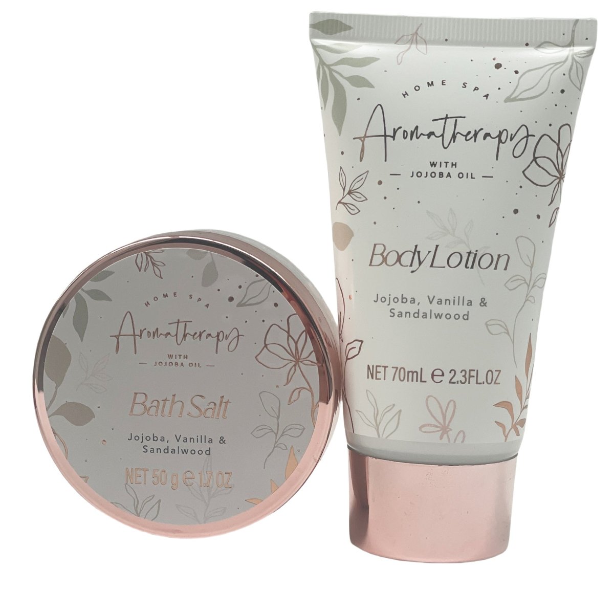 Body lotion tube beside bath salt tin with rose-gold rim; gift set containers