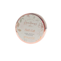 Bath salt tin with rose-gold rim and floral label for jojoba oil, vanilla, sandalwood