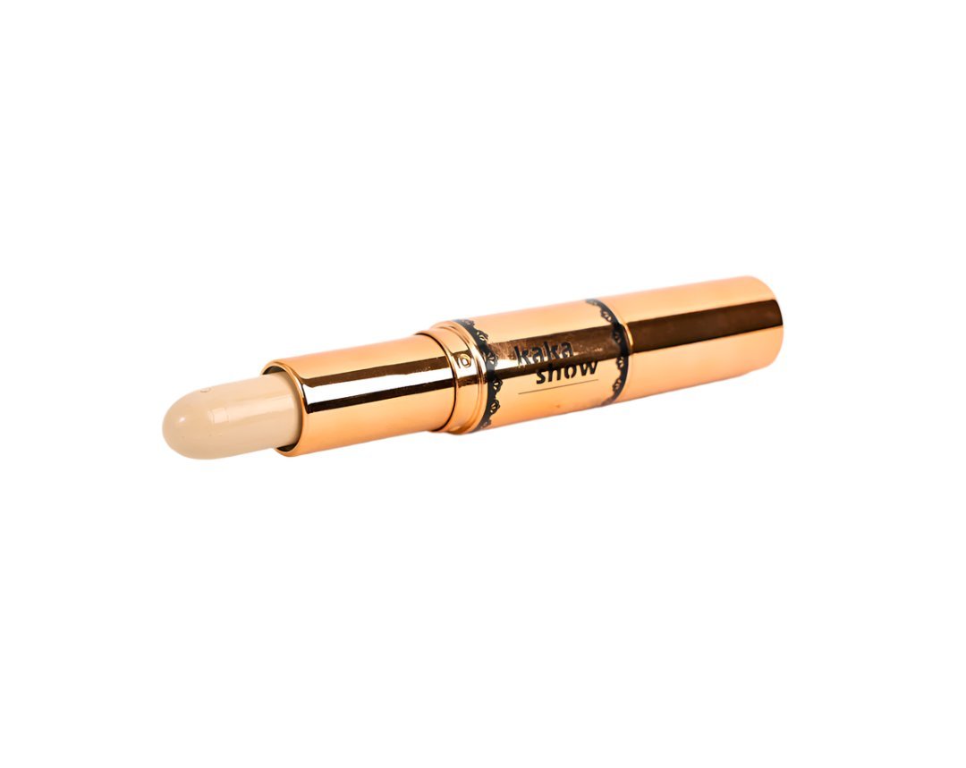 Dual contour and highlight stick with beige tip and gold barrel, side view