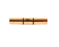 Dual contour and highlight stick in gold casing with black label band