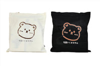 White and black bear tote bags with cartoon bear faces and Japanese text
