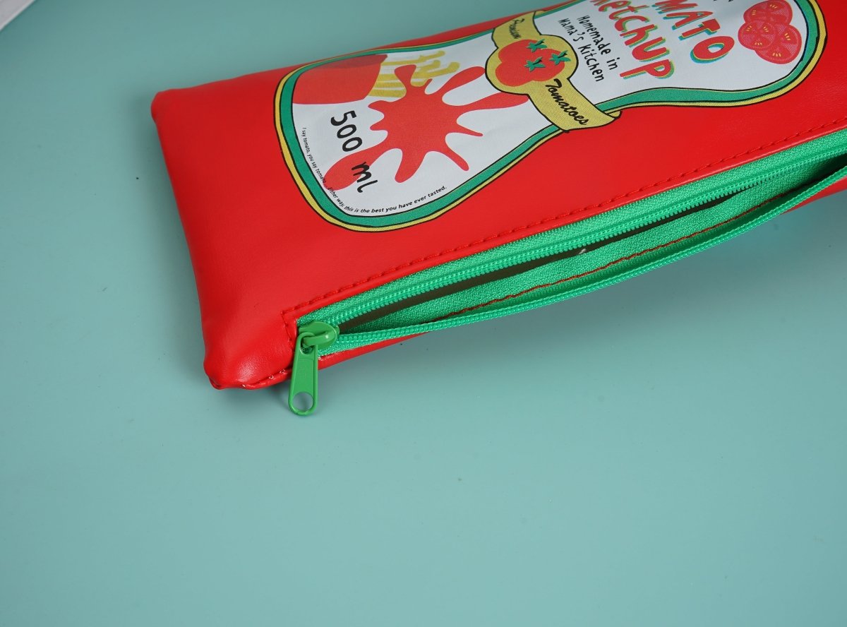 Red ketchup-shaped pencil case with green zipper trim and metal zipper pull