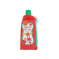 Red ketchup-shaped pencil case with green screw-cap and printed tomato label