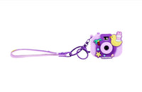 Purple silicone keychain camera with long strap and SURFINGRABBIT charm