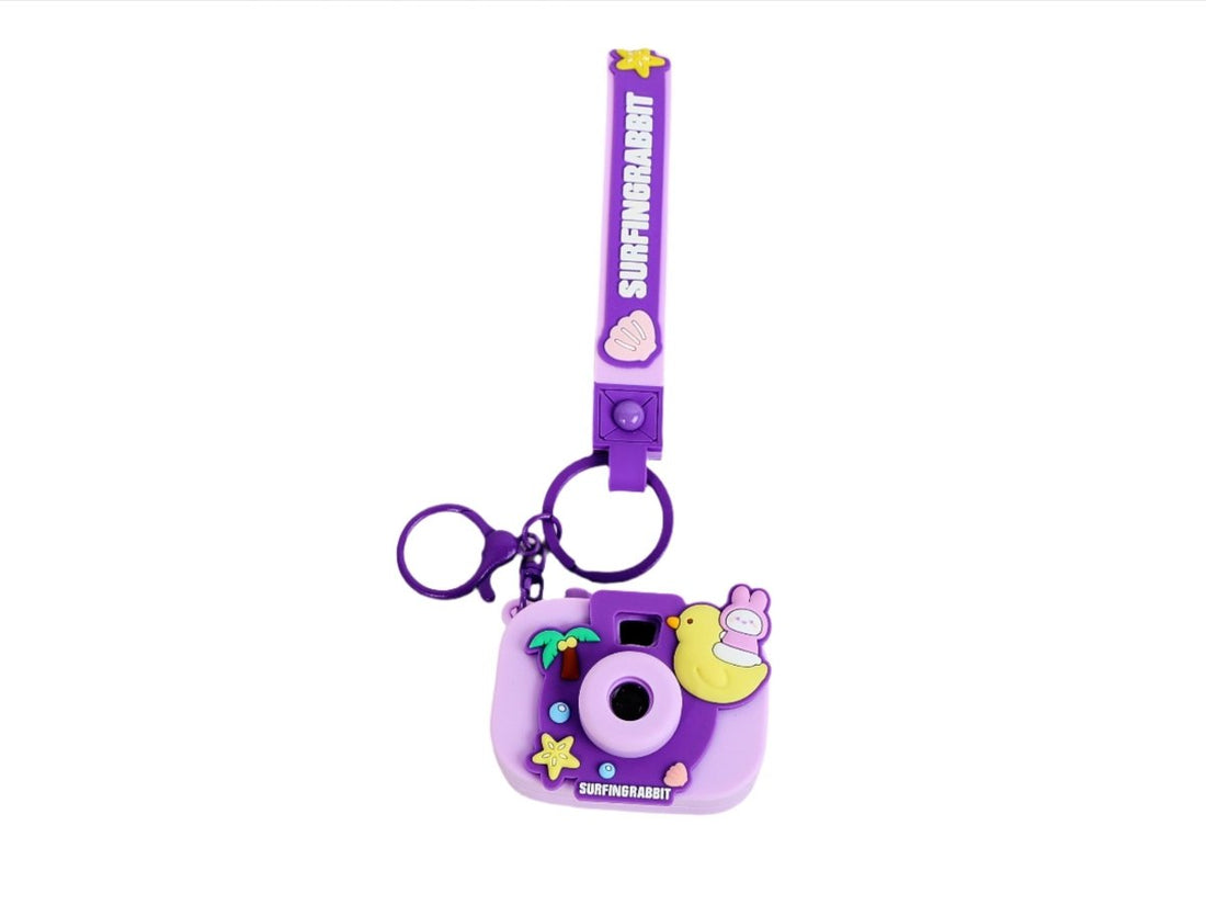 Purple silicone keychain camera with SURFINGRABBIT charm and star detail