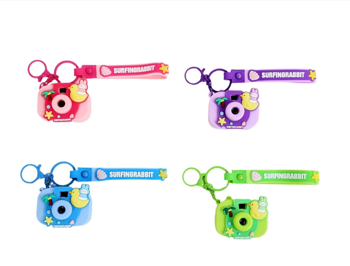 Silicone keychain camera set with SURFINGRABBIT designs in pink, blue, green, purple