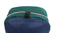 Kids backpack top in green with zipper track and black pull tabs.