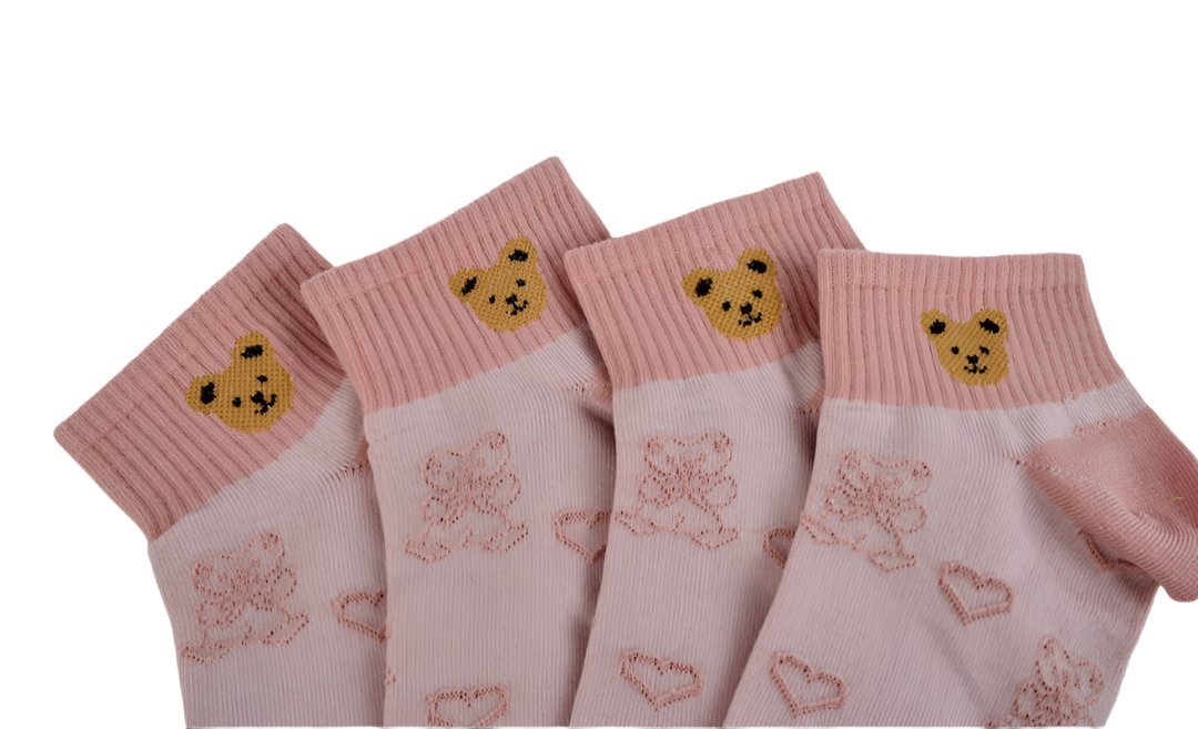 Kids bear socks 4-pack close-up: ribbed pink cuffs with yellow bear faces