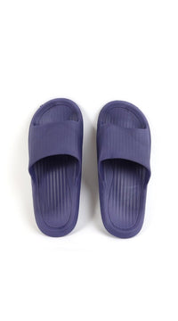 Kids deep purple slide slippers, front view with ribbed texture and slip-on opening.