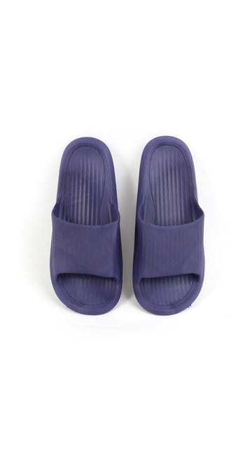 Kids deep purple slide slippers with slip-on open back and cushioned footbed.