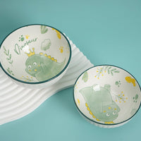 Kids dinosaur bowl set of two, white ceramic with green dinosaur illustrations