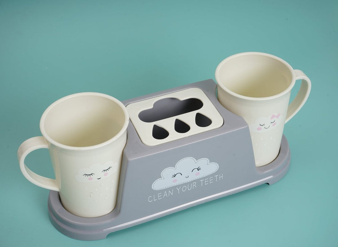 Kids toothbrush holder with two cups, cloud front and toothbrush slots on gray base