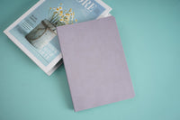 Lavender velvet notebook with simple lined pages, closed cover