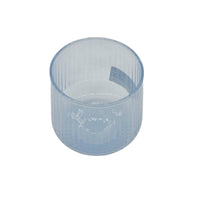 Light blue glass tumbler showing top rim and etched pattern